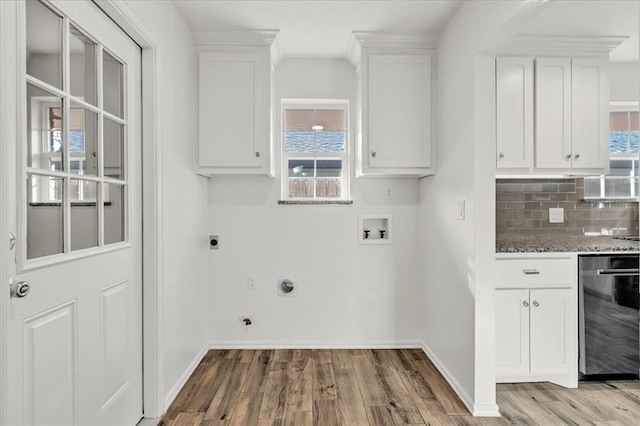 washroom with washer hookup, a healthy amount of sunlight, light wood-type flooring, and electric dryer hookup