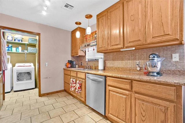 kitchen with backsplash, washing machine and dryer, dishwasher, and pendant lighting