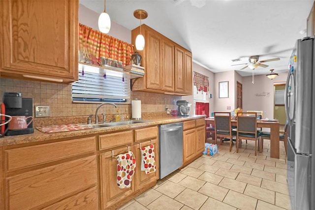 kitchen with decorative light fixtures, ceiling fan, backsplash, and appliances with stainless steel finishes