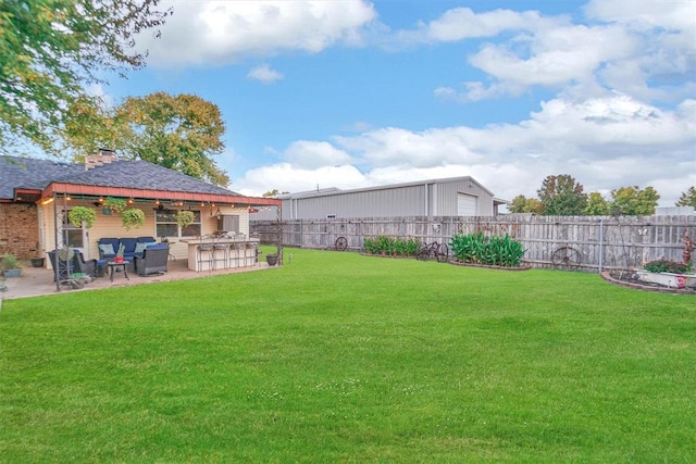 view of yard featuring an outdoor hangout area, a patio area, and an outdoor bar