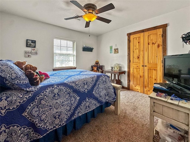 carpeted bedroom featuring ceiling fan