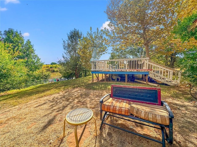 view of property's community with stairway and a wooden deck