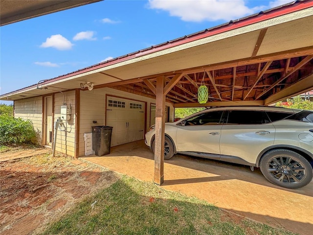 view of vehicle parking with an attached carport