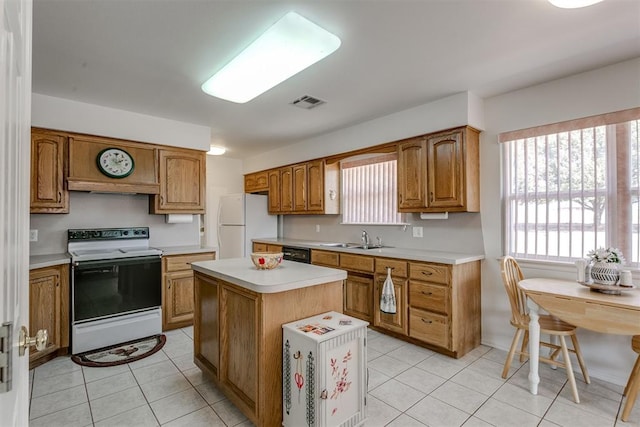 kitchen with custom exhaust hood, white appliances, sink, a center island, and light tile patterned flooring