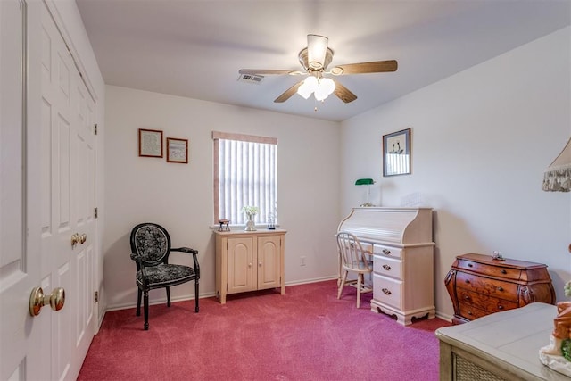 carpeted office space with ceiling fan