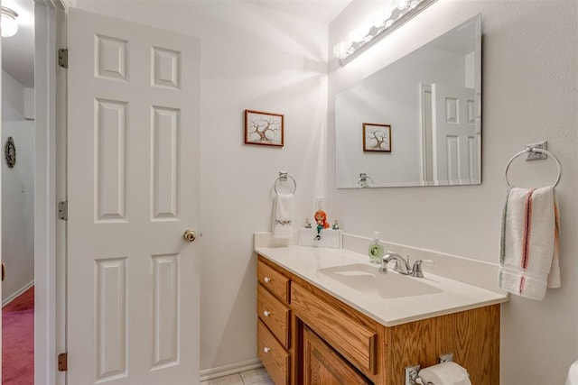 bathroom featuring tile patterned flooring and vanity