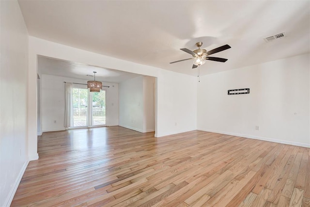 spare room with ceiling fan and light wood-type flooring