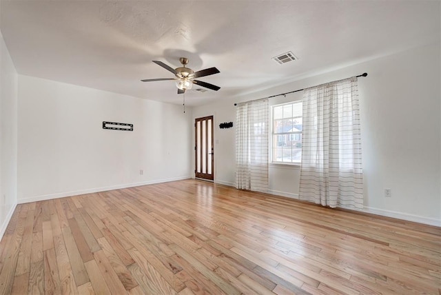 spare room featuring ceiling fan and light hardwood / wood-style floors