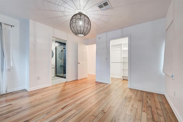 spare room featuring light hardwood / wood-style floors