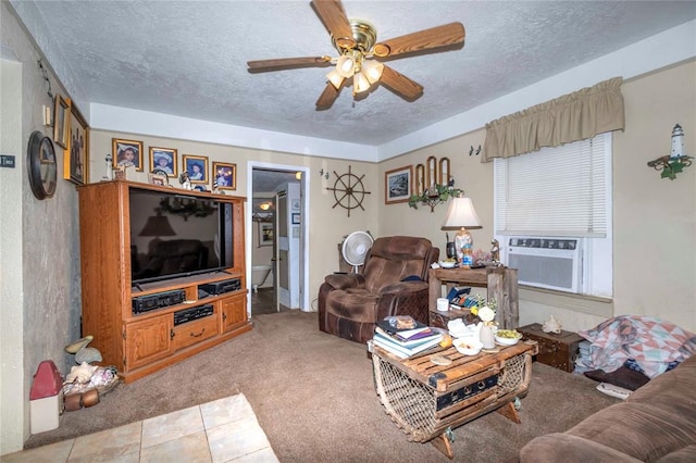 carpeted living room featuring ceiling fan, cooling unit, and a textured ceiling