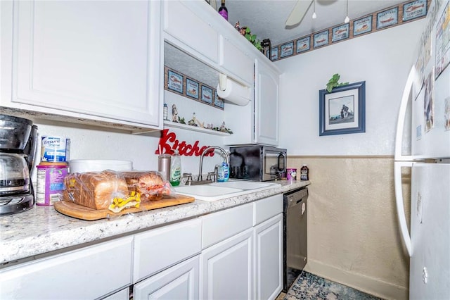 kitchen featuring white cabinets, white fridge, dishwasher, and sink