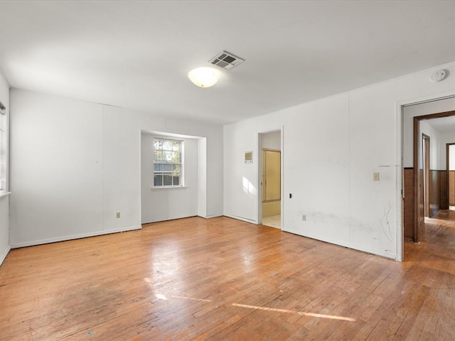 empty room featuring light hardwood / wood-style floors