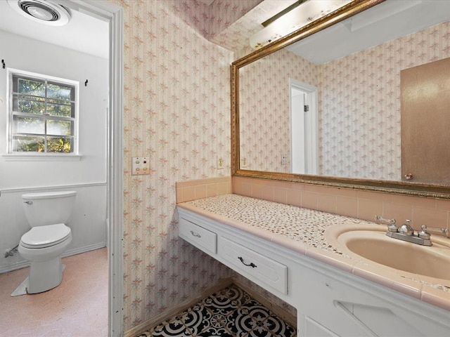 bathroom with vanity and toilet