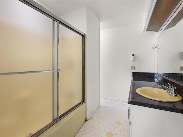 bathroom featuring vanity and shower / bath combination with glass door