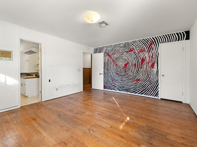 spare room with light hardwood / wood-style floors