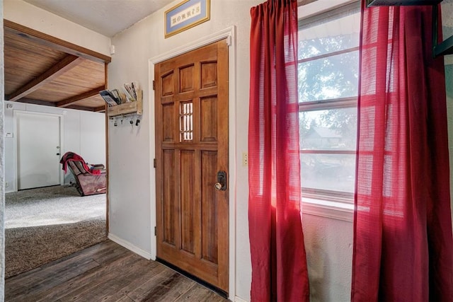 entryway featuring wooden ceiling, beamed ceiling, and dark wood-type flooring