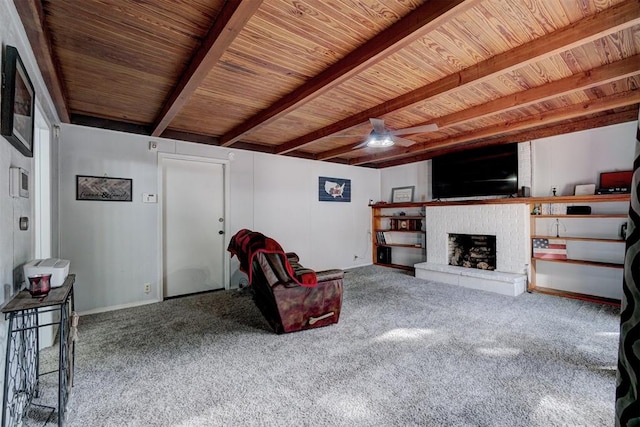 carpeted living room with ceiling fan, beam ceiling, and wooden ceiling