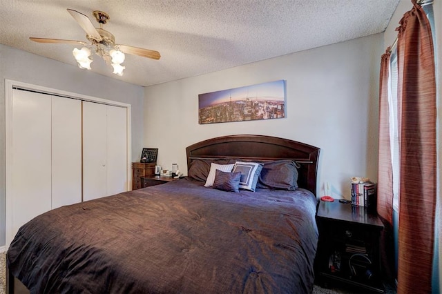 bedroom featuring a textured ceiling, a closet, and ceiling fan