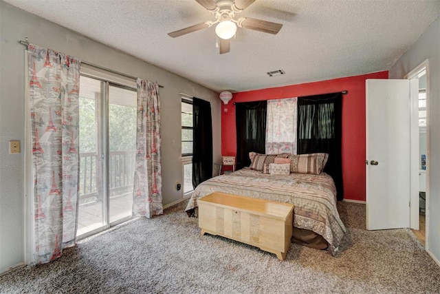 bedroom featuring carpet, ceiling fan, access to exterior, and a textured ceiling