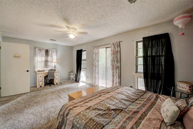 bedroom featuring access to outside, ceiling fan, carpet, and a textured ceiling