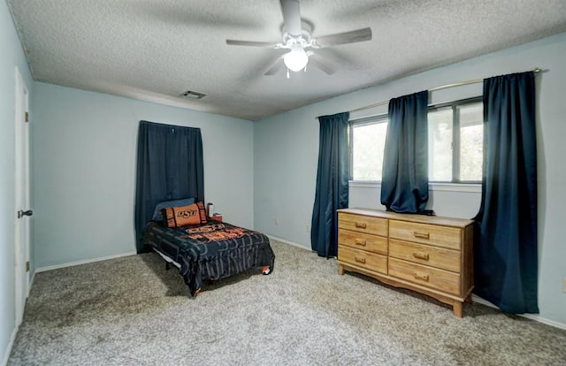 bedroom with light carpet, a textured ceiling, and ceiling fan