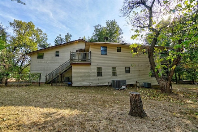 rear view of property featuring central air condition unit