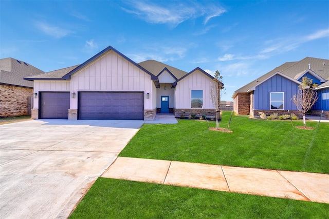 view of front of house with a front yard and a garage