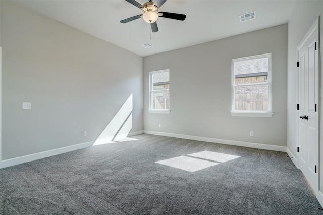 carpeted empty room featuring ceiling fan