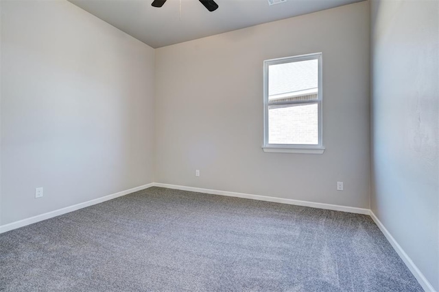 carpeted empty room with ceiling fan