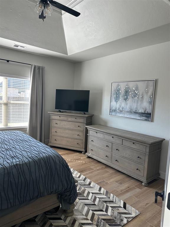 bedroom featuring ceiling fan and light hardwood / wood-style floors