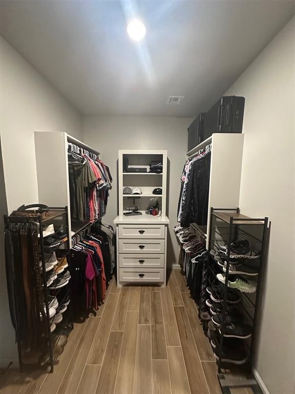 spacious closet featuring hardwood / wood-style floors