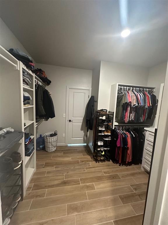 walk in closet featuring light hardwood / wood-style floors