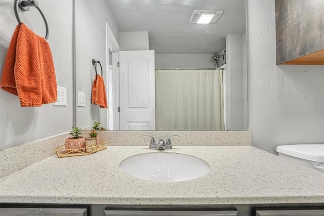 bathroom featuring vanity and walk in shower