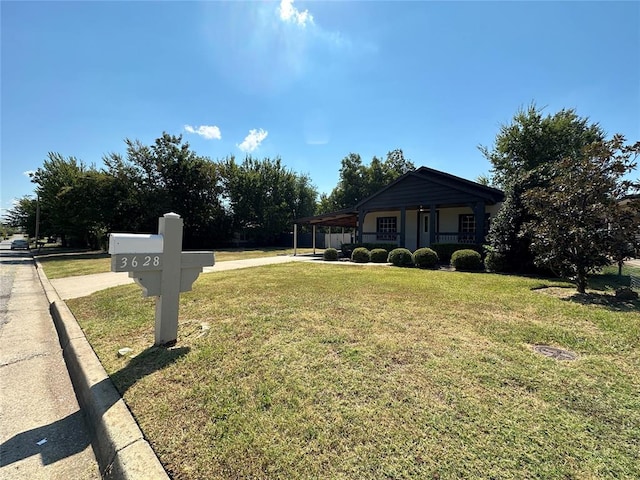 view of front of house with a front yard and a porch