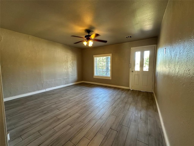 interior space featuring ceiling fan and wood-type flooring