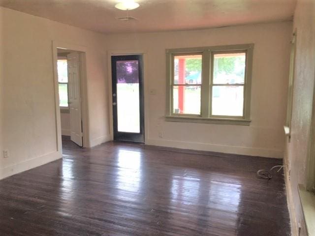 interior space with dark hardwood / wood-style floors