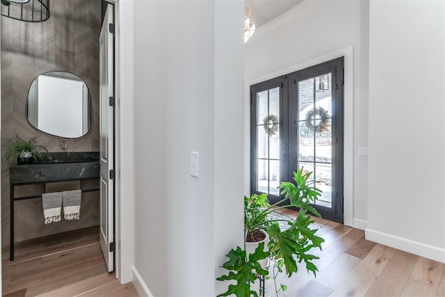 foyer with light hardwood / wood-style flooring