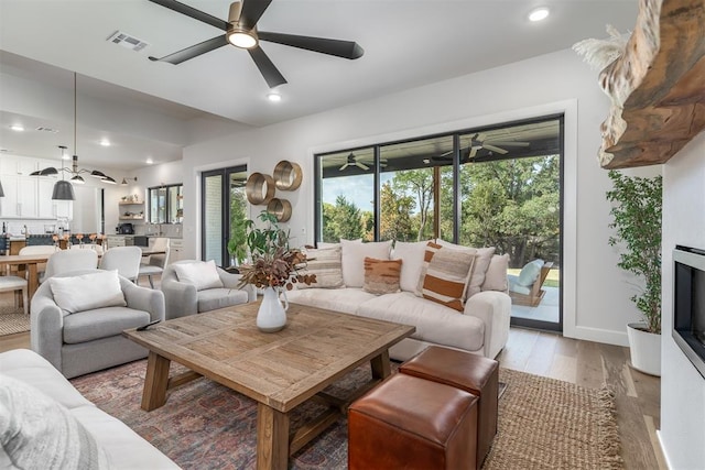 living room with light hardwood / wood-style flooring