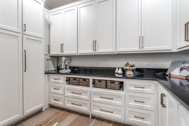 kitchen featuring light hardwood / wood-style flooring and white cabinets