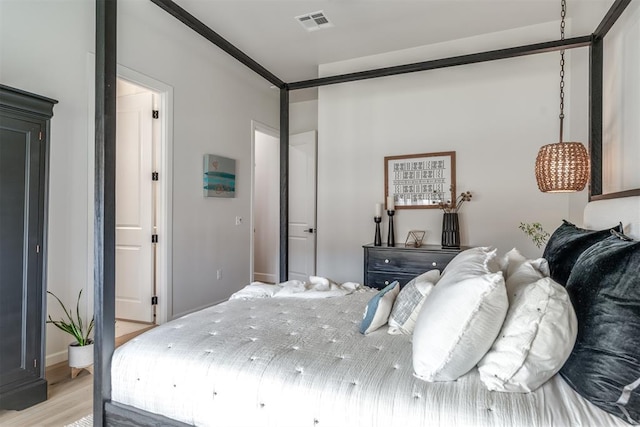 bedroom with light hardwood / wood-style floors