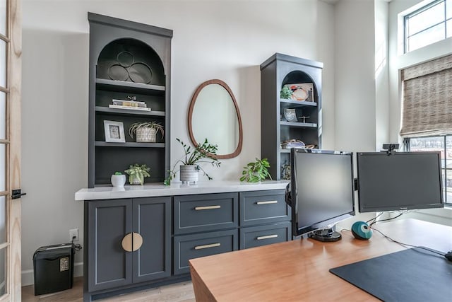 office with light hardwood / wood-style floors