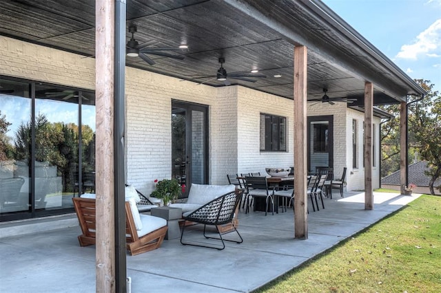 view of patio with an outdoor living space and ceiling fan