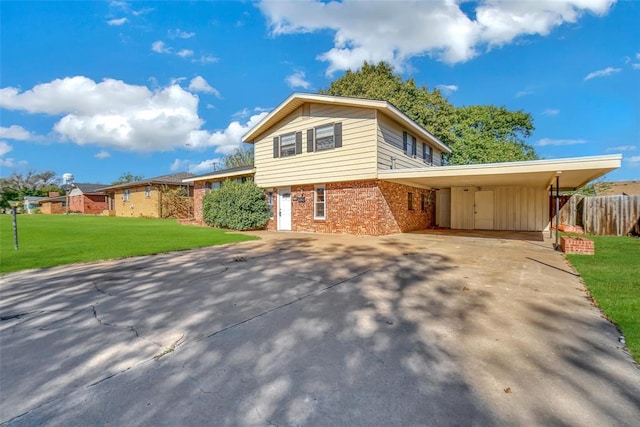 view of front of property with a front lawn and a carport