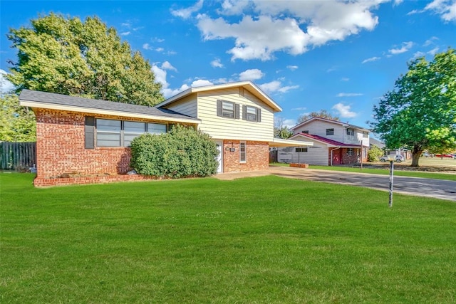 split level home with a front yard and a carport