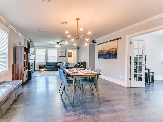 dining room with ceiling fan with notable chandelier, dark hardwood / wood-style floors, and ornamental molding