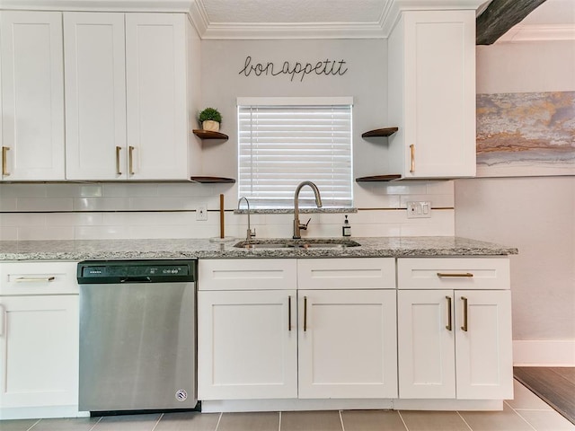 kitchen featuring white cabinetry, sink, light stone counters, stainless steel dishwasher, and crown molding