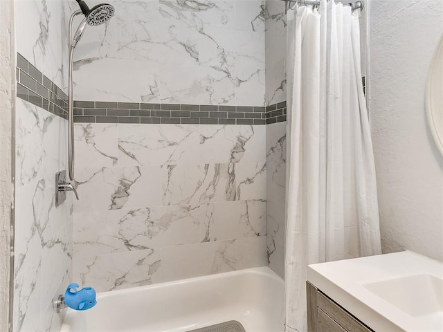 bathroom featuring shower / bath combo and sink