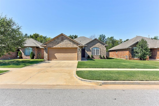 view of front of house with a front lawn and a garage