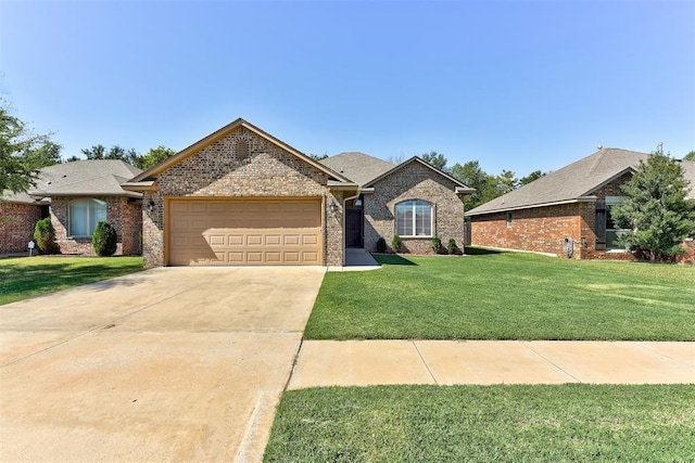 view of front of house with a garage and a front yard