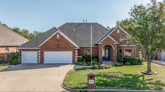 front facade with a garage and a front yard